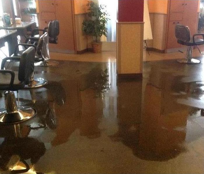 Water flooding a hair salon in East Indianapolis
